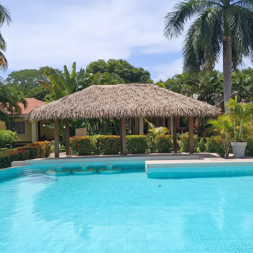 Resort pool area under a synthetic thatch roof